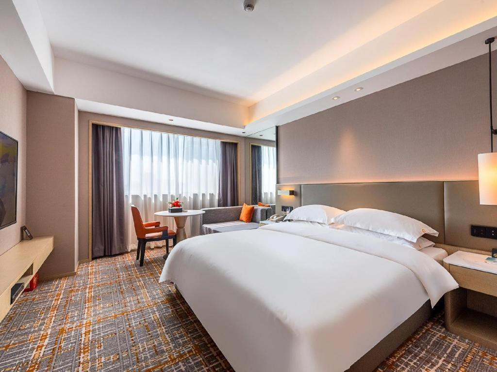 Overseas Chinese Hotel Csuhaj Kültér fotó