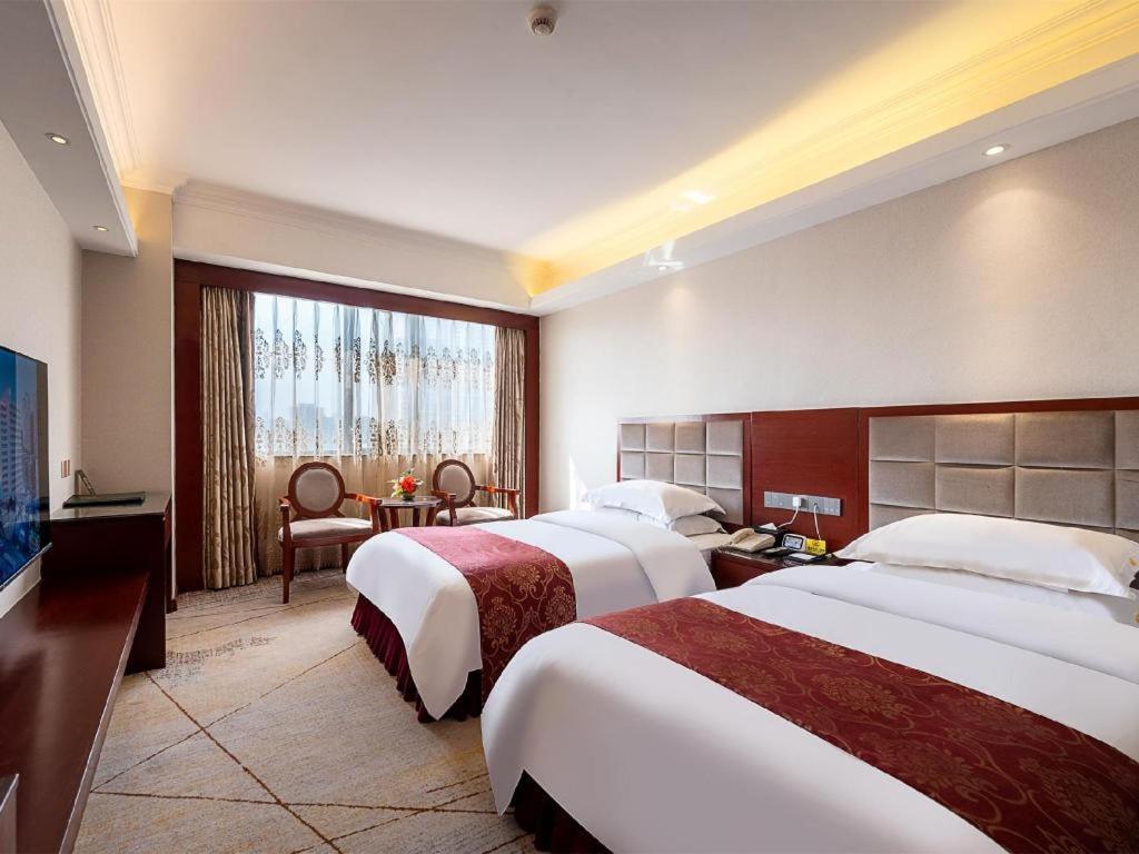 Overseas Chinese Hotel Csuhaj Kültér fotó
