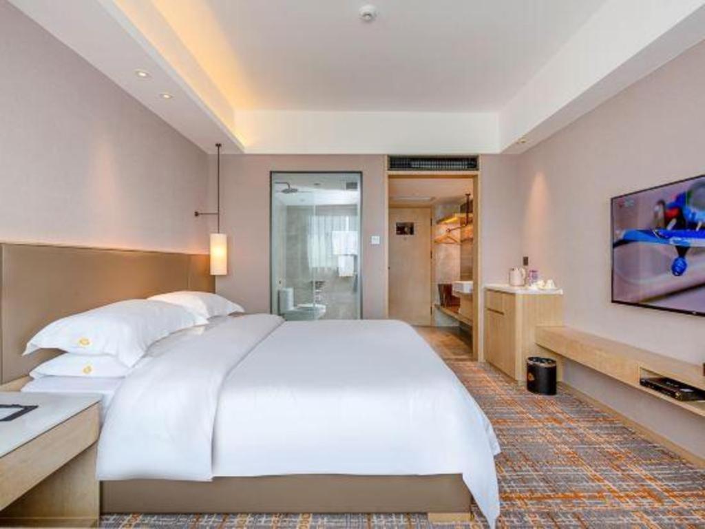 Overseas Chinese Hotel Csuhaj Kültér fotó