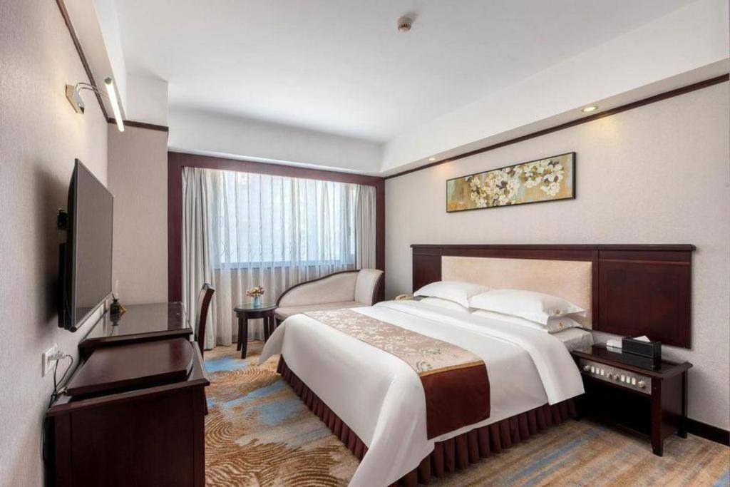 Overseas Chinese Hotel Csuhaj Kültér fotó