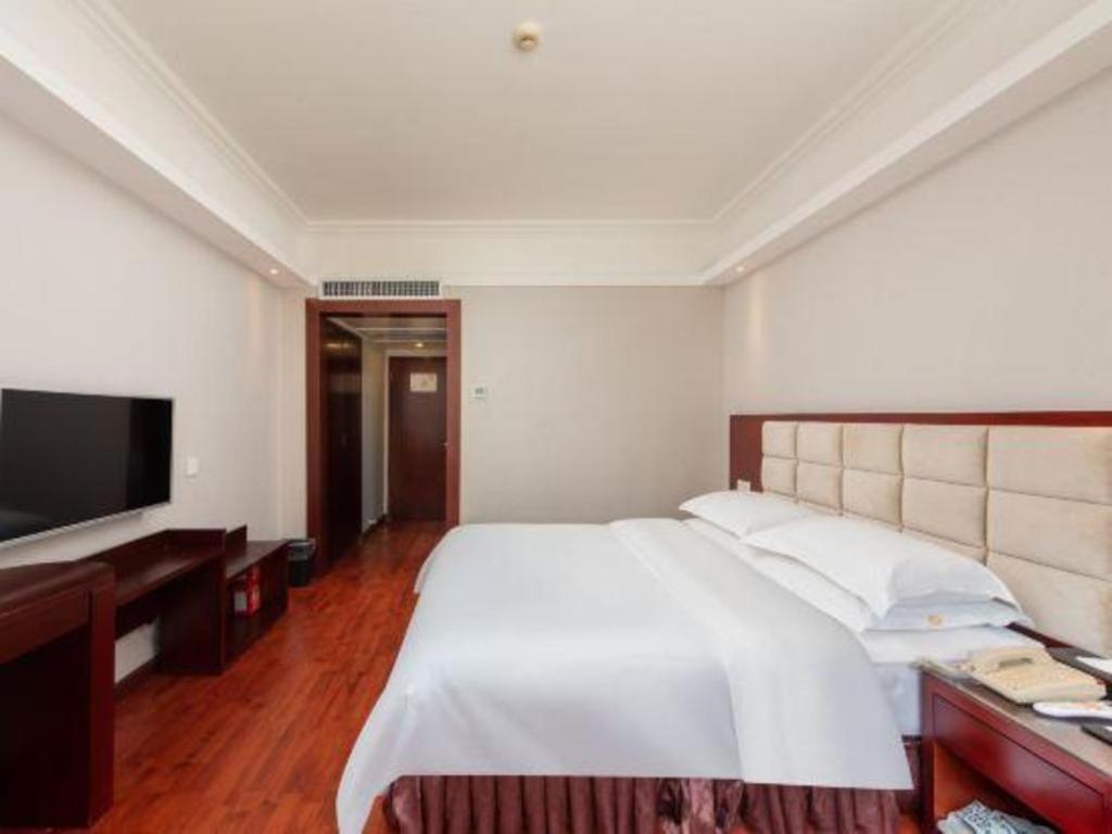 Overseas Chinese Hotel Csuhaj Kültér fotó