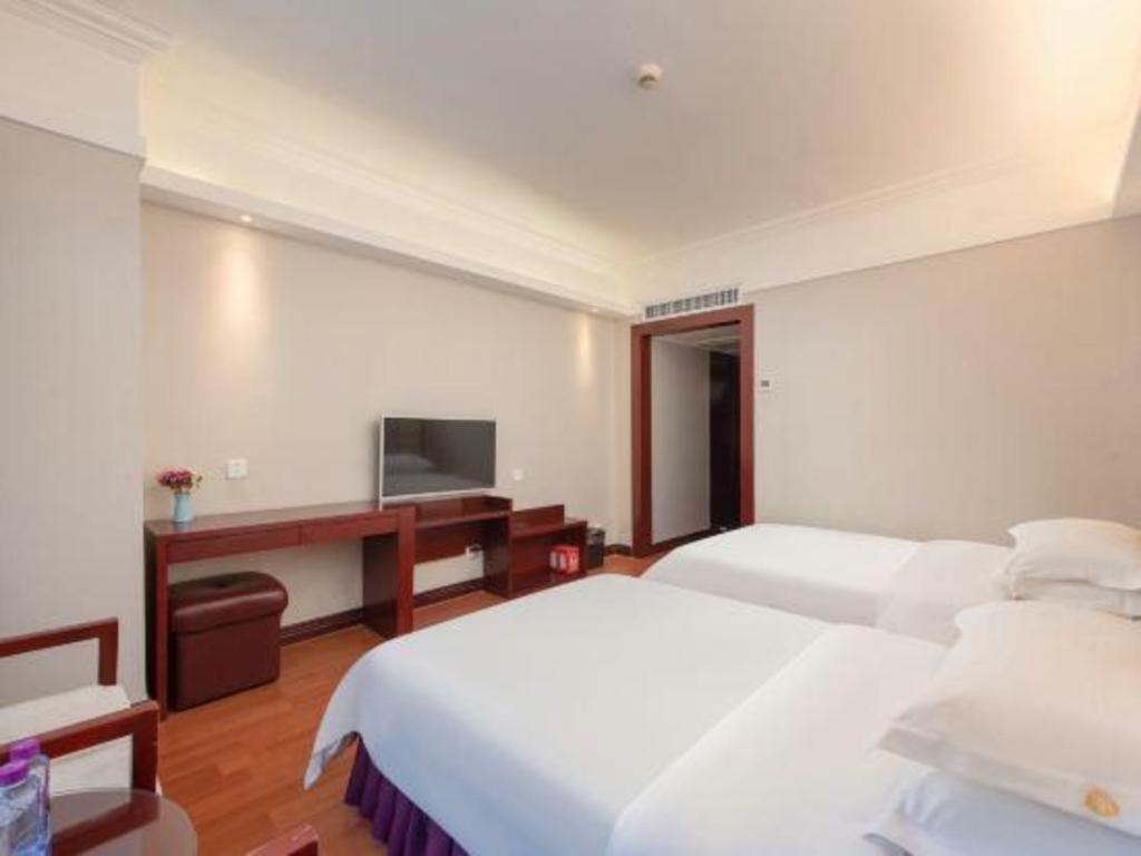 Overseas Chinese Hotel Csuhaj Kültér fotó