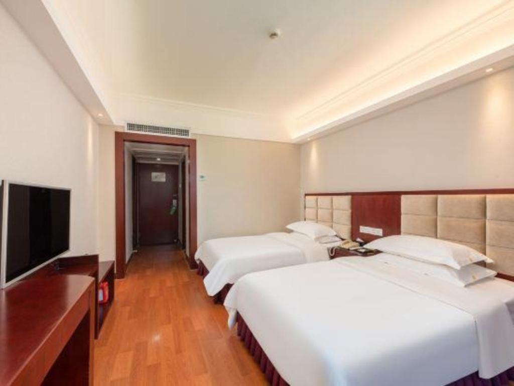 Overseas Chinese Hotel Csuhaj Kültér fotó